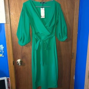 Green off the shoulder midi dress.